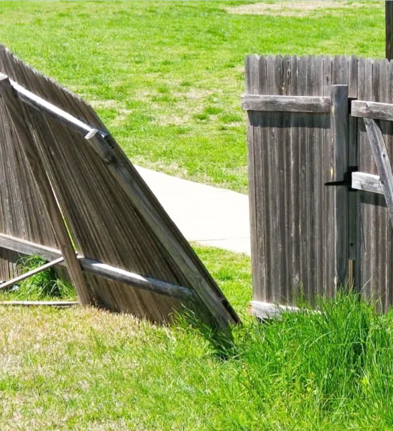 Damaged leaning wood fence panels in need of structural repair in Edina, MN